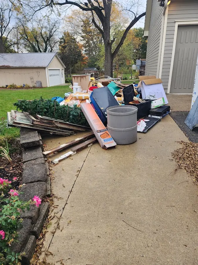 Dumpster being loaded with debris for 30 Yard Dumpster Rental in Jonesboro